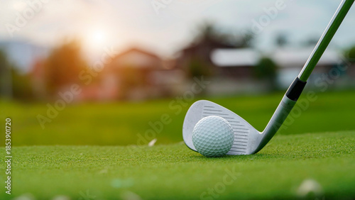 Картината върху платно Golf clubs and golf balls on a green lawn in a beautiful golf course with morning sunshine