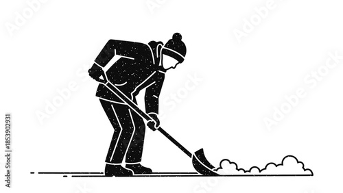 Man shoveling snow in winter with shovel and warm clothing