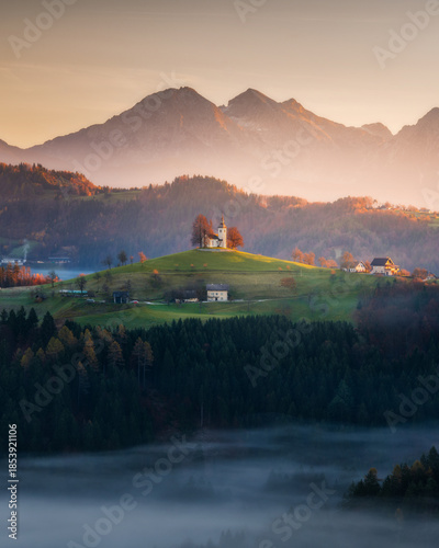 Misty morning at Slovenian landscape church St. Thomas, landscape