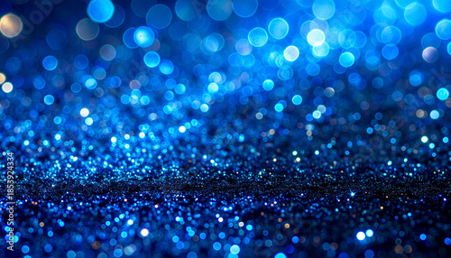 大小の玉ボケと青いグリッターが煌めく華やかな背景