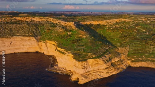 Drone view of sunset spot. Countryside, rocks, hills. Dingli cliffs, Mediterranean sea, Malta island