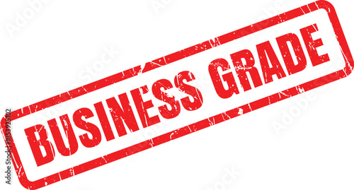 Red grunge rubber stamp with BUSINESS GRADE text on a clean white surface indicates high quality