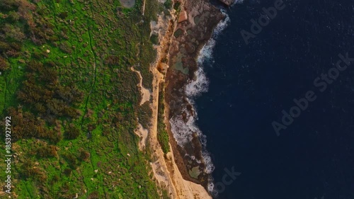 Drone top view of famous sunset spot. Countryside, rocks. Dingli cliffs, Mediterranean sea, Malta 