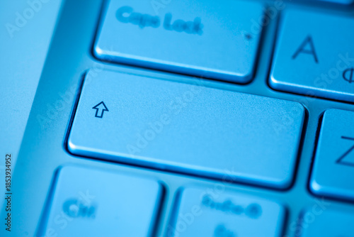 Close-up computer keyboard keys, top view.
