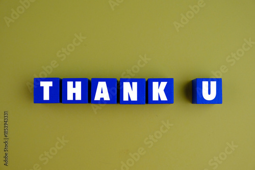 text of THANK YOU on wooden cube for appreciation and card concept.