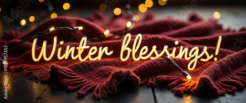 Winter blessings text illuminated by fairy lights on dark blanket  