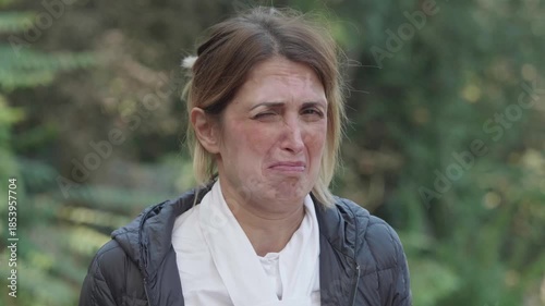 A blonde woman with vitiligo reacts strongly to a terrible smell. Expressive and humorous scene capturing disgust, surprise, and spontaneous human reaction.