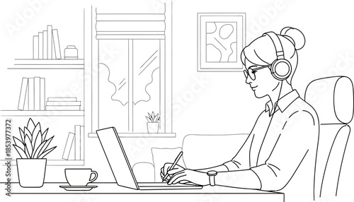 Woman wearing headphones working on laptop at home office desk with books plant and coffee