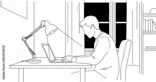 Man sitting at desk working on laptop computer with lamp on desk in front of window at night
