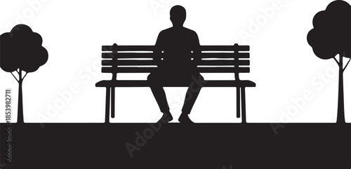 Man sitting on park bench overlooking city skyline at sunset