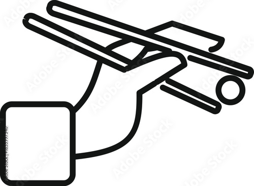 Hand holding chopsticks, picking up a round food item, on white background