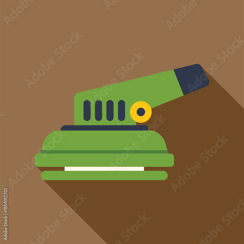 Green orbital sander power tool with long shadow on brown background