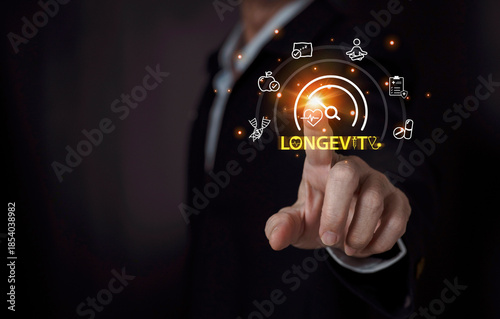Businessman point to the floating health and longevity icons, symbolizing wellness innovation, digital healthcare, and future lifestyle technology.
