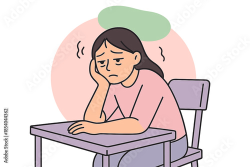 Student sits at desk looking sad and worried during class in a school setting