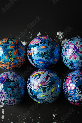 Composition of New Year's balls painted with Petrykivka painting