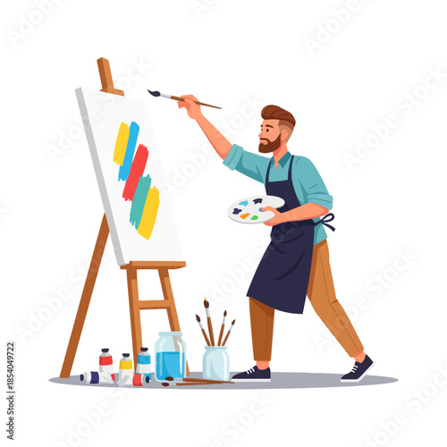 Creative male artist in apron painting colorful abstract artwork on easel with art supplies