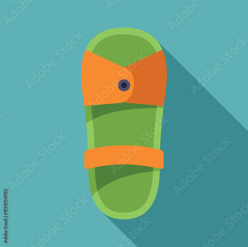 Green and orange sandal with an ankle strap, a button detail, and a long flat shadow