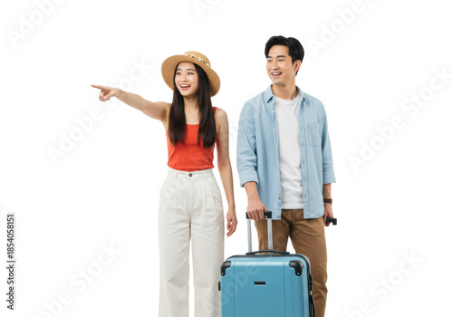 Young asian couple, early 20s, she in red tank top & white pants points forward, he in blue shirt, both smiling, pulling modern suitcases on transparent background, concept of travel and adventure