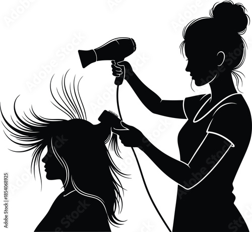 Hairdresser drying woman's hair with hairdryer and brush