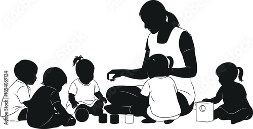 Silhouette of a daycare worker playing with multiple toddlers in a group setting with toys