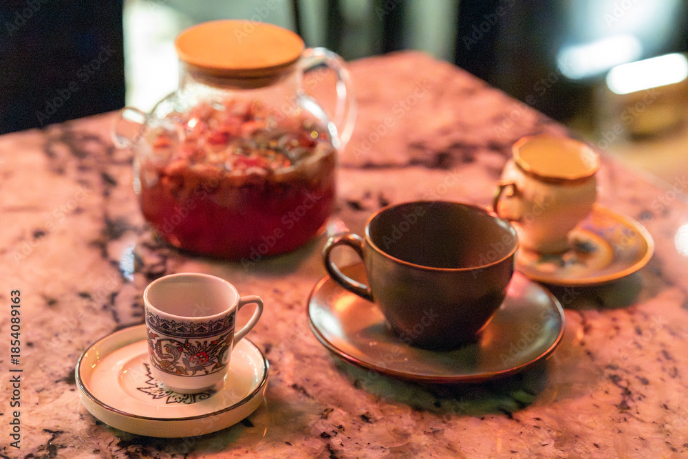 Fototapeta premium Vintage Cups and Herbal Teas on Cafe Table