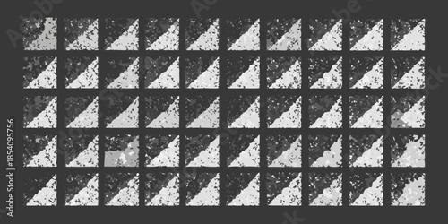A grid of abstract grayscale shapes resembling fragmented or decaying forms