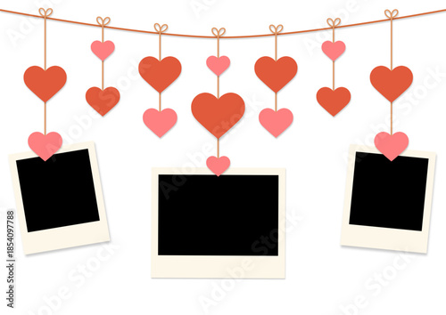 blank instant photo frames hanging on clothespin with red and pink hearts