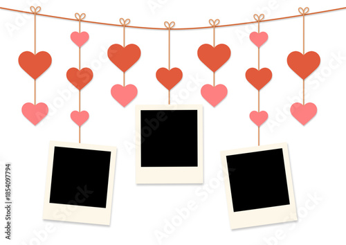 blank instant photo frames hanging on heart strings