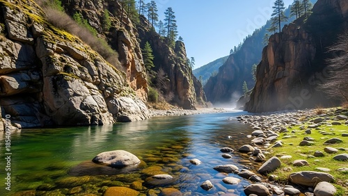Emerald River Flowing Through Sunlit Canyon Gorge with Visible Riverbed Rocks.