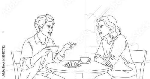 Two friends chatting and enjoying coffee together at a table with croissant