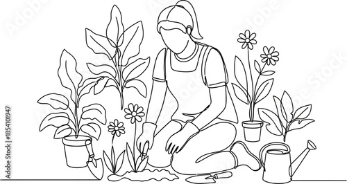 woman planting flowers and plants in garden with tools and watering can
