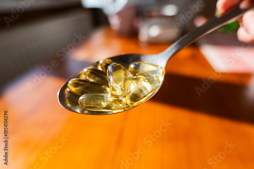 fish oil Omega-3 capsule or fish oil Omega-3 supplement close up. Healthy eating, medicine, health care, food supplements concept