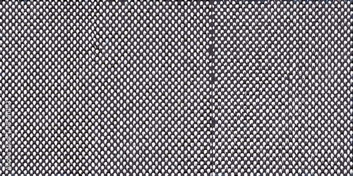 Close up view of a woven gray textile with a tight repeating pattern