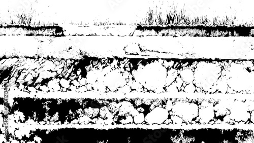 Old grungy stone wall with layers of roughhewn rocks and plants