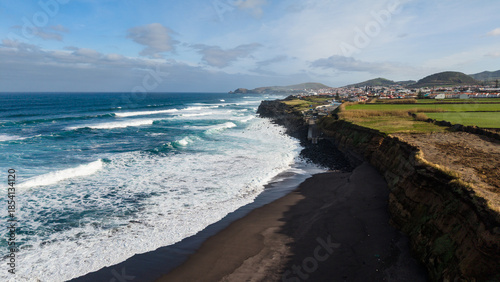 Great coastal landscapes, with blue ocean and black sand, traveling Portugal.