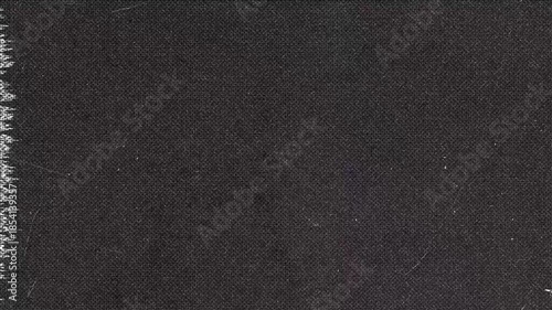 Dark fabric texture background with damage and edge fray