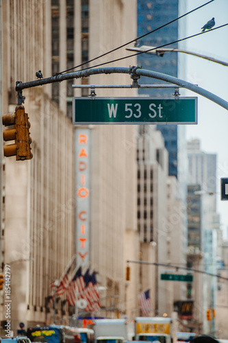 New York, USA, 9 August 2025: West 53rd Street sign in Midtown view. Urban roadway signage above busy commercial street in Manhattan