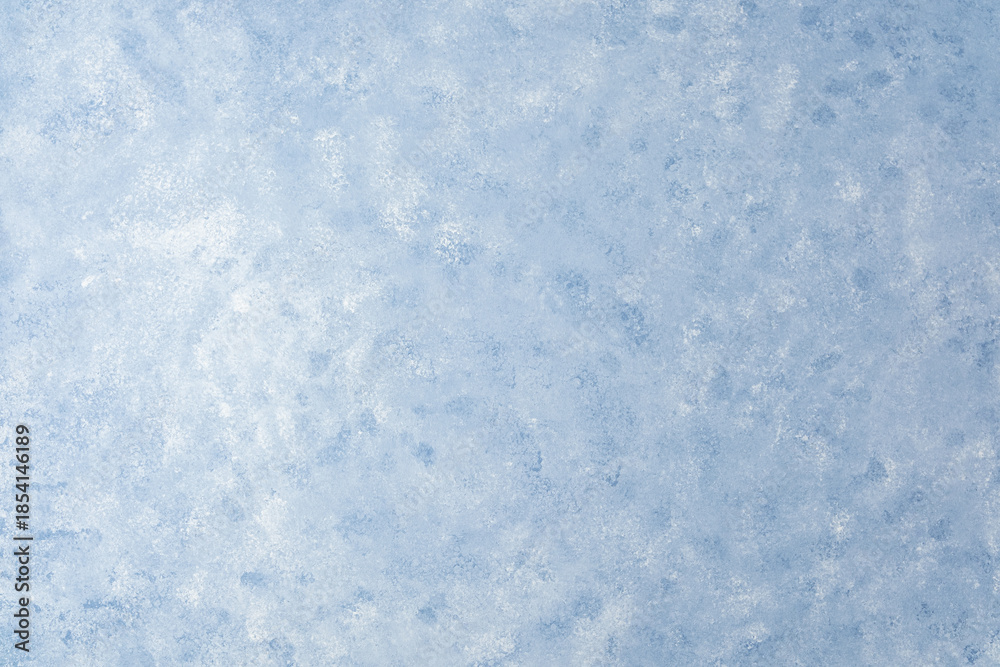 Obraz premium Light blue wall texture with soft mottled pattern and plaster effect