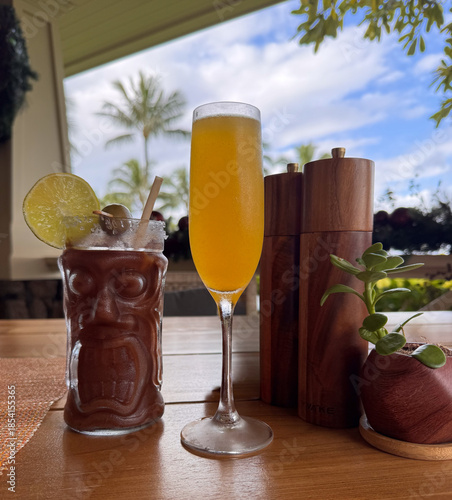 tropical breakfast cocktails in a lush, vibrant outdoor setting