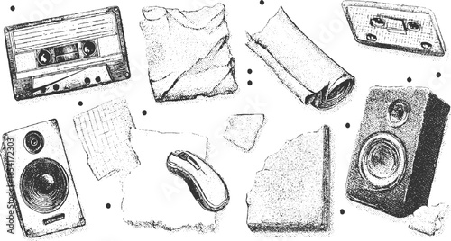 Vintage audio speakers and cassette tapes scattered with torn paper and computer mouse