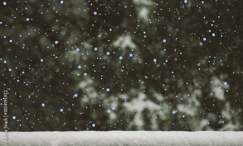 Falling snow and winter atmosphere over a snow-covered foreground on transparent background