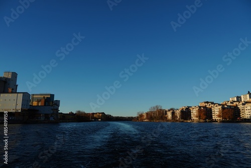 Photography Boat Wake on River Leading Through Stockholm