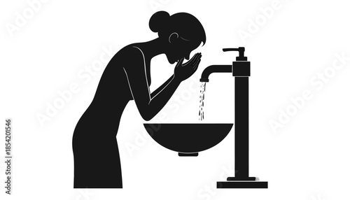 Silhouette of a woman washing her face in a sink.