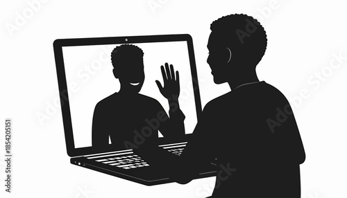 Silhouette of a person video conferencing with another person on a laptop.