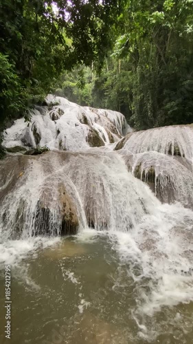 waterfall in the forest, Saluopa Waterfall in Tentena. Central Sulawesi. Indonesia.