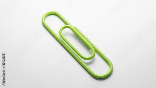 Wallpaper Mural Green paperclip isolated on white background Torontodigital.ca