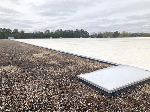 Photos TPO and Ballast type roofing with a skylight