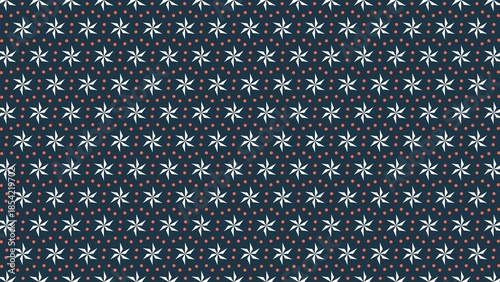 A blue and white floral pattern with red dots