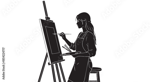 A creative female artist diligently working on her masterpiece at an easel