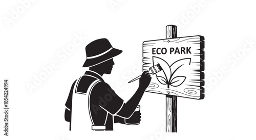 A person diligently paints an eco park sign, symbolizing dedication to nature and conservation